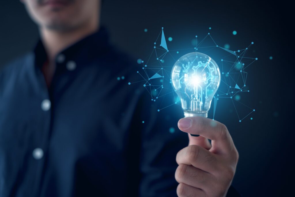 Idea,Innovation,And,Inspiration,Concept.hand,Of,Man,Holding,Illuminated,Light